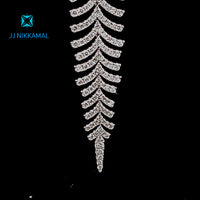 18KT WHITE GOLD DIAMOND EARRINGS, A MESMERIZING MANIFESTATION OF ELEGANCE AND GRACE. THESE STUNNING EARRINGS BOAST A UNIQUE LEAF DESIGN, CRAFTED TO PERFECTION BY OUR EXPERT ARTISANS