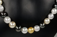 Beautiful Strand of South Sea Pearls in Multi Color with Studs in Solid White Go